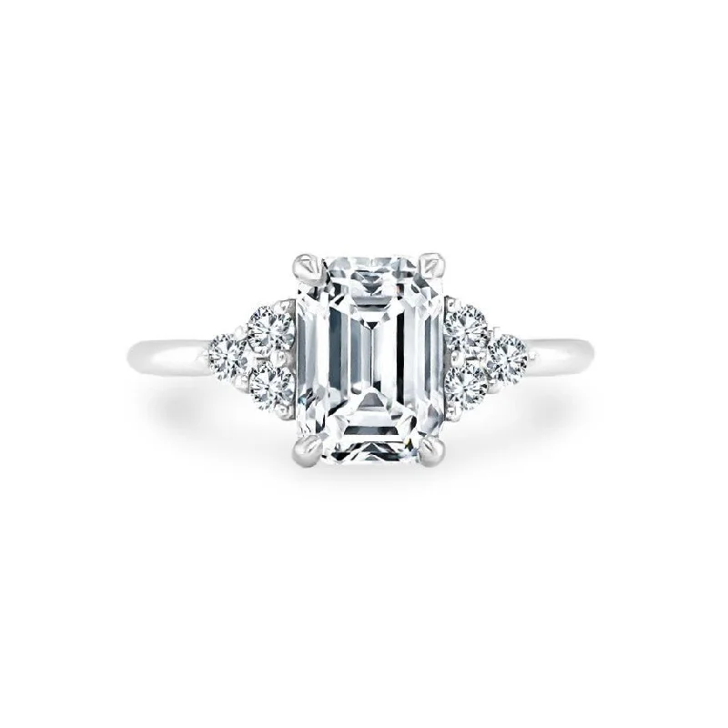 Emerald Cut with Round Trio Side Stones