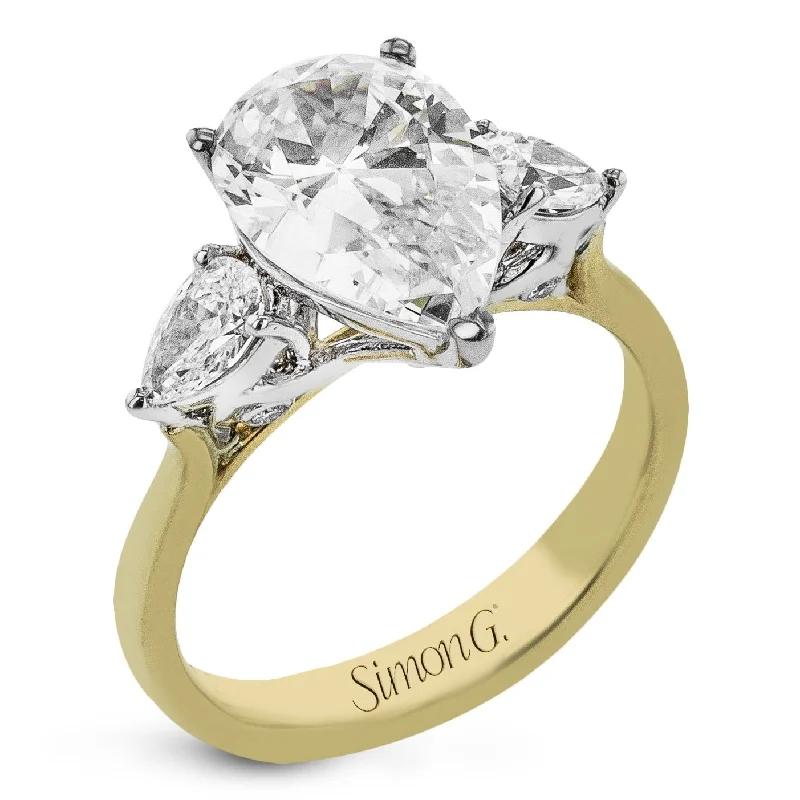 Pear-cut Three-stone Engagement Ring in 18k Gold with Diamonds