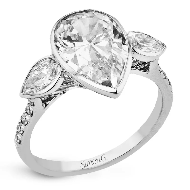 Pear-cut Three-stone Engagement Ring in 18k Gold with Diamonds